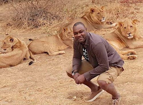 Yes, this picture of Patrick Mboma in front of lions is authentic