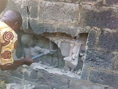 Was a child truly found trapped inside the walls of a house in Cameroon?